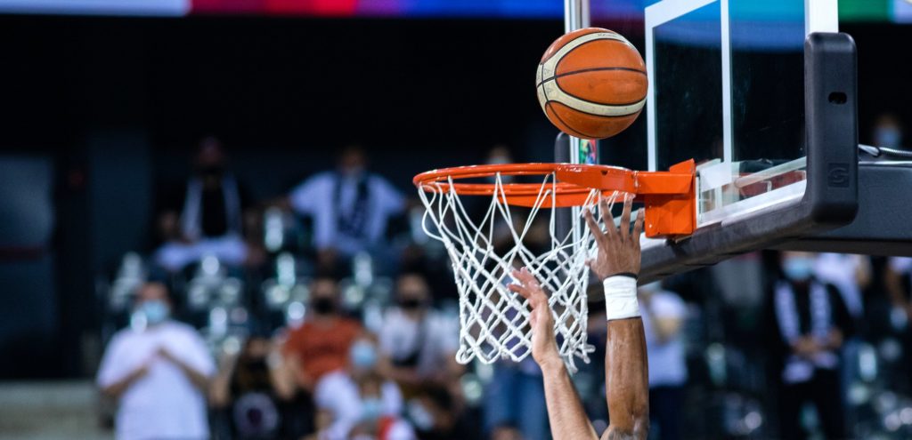 basketball going through hoop during game