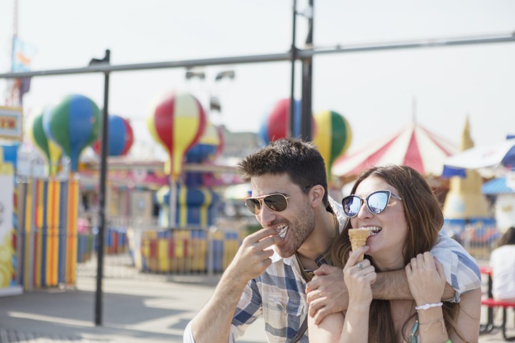 Couple eating ice cream cones, Coney island, Brooklyn, New York, USA